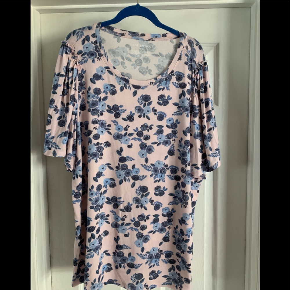 This is a pale pink and blue patterned sweater